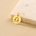 Golden Libra zodiac cutout round pendant crafted from polished stainless steel - Libra - Gold