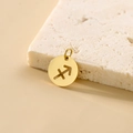 Gold stainless steel round pendant featuring a hollow Sagittarius zodiac sign symbol - Sagittarius - Gold