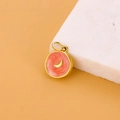 Detail of round star and moon pendant with orange enamel and gold-plated finish - Orange Red Moon Pendant (JP43614D3K0)