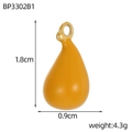 Macro detail of yellow resin star fruit pendant with dimensions 1.8cm by 0.9cm - Ginger Yellow Teardrop Style (BP3302B1)