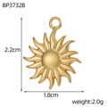 Detailed close-up of a 2.2cm golden sun face pendant charm for DIY jewelry making - Embossed Wave Ray Style (BP3732B)