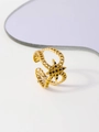 Macro detail of gold-plated double-layer chain ring with black stone star element - Hexagonal Star Stone Style (FJ35139D0W0)