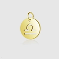Macro detail of gold Libra zodiac cutout pendant with polished mirror finish surface - Libra / Combination Style / Steel