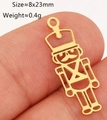 Detailed view of a gold-plated nutcracker soldier charm for DIY jewelry making - Gold Hollow Nutcracker (DY1244--2)