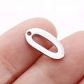 Polished silver stainless steel oval leaf charm shown on fingertip for DIY jewelry size - Hollow Oval (DY765-1)