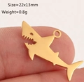 Close-up of golden shark pendant showing 22x13mm size and polished steel finish - Gold Shark (DY1287-2)