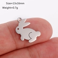 Polished stainless steel rabbit pendant charm on finger showing 13x16mm scale - Rabbit Shape (DY1131-1 Steel Color)