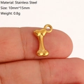 Golden bone shaped stainless steel pendant 10x15mm shown on fingertip for scale - Bone Style (DY1191-2) Gold