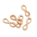 Cinq connecteurs symbole infini en or rose pour la création de bijoux et colliers - Or rose