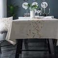 Detail of waterproof geometric tablecloth and matching cushion in modern minimalist style - Falling Leaves With Curled Edges / 90x90cm