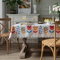 Rectangular cream linen tablecloth with colorful floral patterns in a cozy dining setting - Beige with Print
