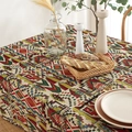 Bohemian geometric woven tablecloth with thick ethnic patterns on a set dining table - Geometric Multicolor (Hemmed)