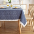 Polka dot tablecloth in navy blue with white lace edges on a wooden dining table - Navy Base White Dot with Lace
