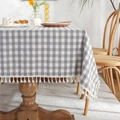 Gray and yellow checkered tablecloth with white tassels on a wooden dining table - Silver Gray Yellow With Tassel