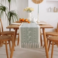 Light green Nordic table runner with reindeer motifs and handcrafted fringe tassels - White Deer With Tassels