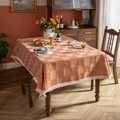 Orange and white plaid jacquard tablecloth with tassel fringe on a wooden table - 140x140 / Orange Striped Grid