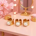 Adjustable gold plated ring featuring a large freshwater pearl surrounded by crystals - Adjustable Open / White