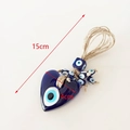 Blue heart-shaped Turkish evil eye glass pendant hanging with natural jute rope - Heart