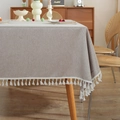 Minimalist beige polyester table cloth with cotton tassels on a wooden dining table - 60x60cm / Beige
