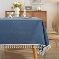 Dark blue polyester table cloth with white tassels on a light wood dining table - 60x60cm / Blue
