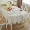Rectangle cream linen tablecloth featuring green vine embroidery and white fringe tassel - Oval Embroidered Green Flower (Tassel)