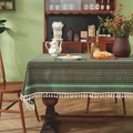 Bohemian style forest green striped tablecloth with white tassels on a rustic wooden table - 60x60cm / Green