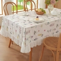 Floral cotton tablecloth with ruffled edges and small flower prints in a cozy dining setting - Small Square / Colorful Floral Ruffle