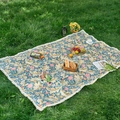 Blue jacquard picnic mat with vintage flower patterns and white tassels on green grass - 60x60 / Moly Style + Dense Tassels