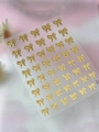 Golden 3D bow nail art stickers with embossed metallic texture and adhesive backing - Jelly Gold Stamping (YT7221Pro)