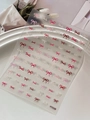 3D embossed nail stickers featuring red and pink bows, variant style YT7638 on white plate - Red and Pink Bowknot Combo (YT7638)