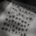 Macro shot of spider and web nail art stickers on a textured black lace background - TY3688 Embossed