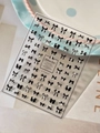 Adhesive nail art stickers featuring black ribbon bows with elegant pearl accents - Artificial Pearl Embossed Black (YT6923P)