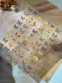 Vibrant butterfly nail stickers with holographic textures and leopard patterns - Shell Light Yt7260te