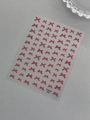 Red bow tie nail art stickers with ribbon texture detail on transparent backing - Red (YT7333Pm)