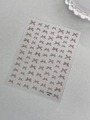 Self-adhesive nail stickers featuring brown Morandi bow designs and YT7340 model detail - Brown (YT7340Pm)