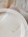 3D white embossed bow nail art stickers with YT7159 pattern on white ceramic dish - White Embossed Style (YT7159)