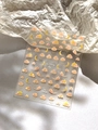 Close-up of holographic nail stickers with pink clouds, yellow moons, and starry sky patterns - Dreamy Sky Cloud Moon (YT4626)