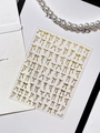 Macro detail of gold bow nail art stickers featuring metallic textures and pearl decor - Gold Metallic Texture Bow (YT6255Hj)