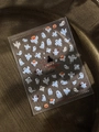Detail view of Halloween nail stickers featuring white ghosts and pumpkins on a dark tray - Flat Ghost Pumpkin (YT6534Pm)