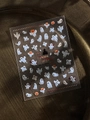Macro detail of Halloween nail stickers featuring white ghosts and pumpkins on clear film - Rhinestone Ghost Pumpkin (YT6535PmS)