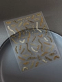 Macro view of 3D embossed gold fishbone and skeleton nail stickers with starry elements - Gold Film Stitches (YT6114Nj)