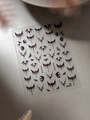 Macro detail of 6D Halloween nail stickers featuring 3D bats and colored eyeballs YT6531 - Jelly Bat Eyeball (YT6531Gd)