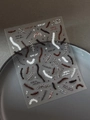 Detailed view of Halloween wound suture nail stickers with star motifs on a grey tray - Relief Scar Stitches (YT6116)