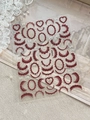Detail view of burgundy lace and heart pattern embossed French nail art stickers - Wine Red Lace (YT6369)