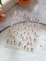 Detail shot of relief rose nail stickers with floral patterns and script elements - Pink Rose Style (YT6421)