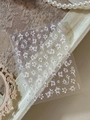 Detail of white flower relief nail stickers with orange centers on a wooden frame - Relief Style (YT5997)