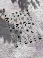 Detail of Halloween nail art stickers with spiders, bats, and webs on a textured backdrop - Embossed Style-Spider Bat Tombstone (YT6742)