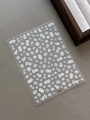 Close-up of YT6275 white and light blue floral relief nail stickers on gray background - Relief White Flower (YT6275)