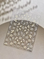 Close-up of embossed white and yellow petal nail stickers with floral patterns on YT6648 - Embossed Short Yellow (YT6648)