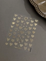 Golden embossed heart nail art stickers with striped and dotted patterns on gray background - Bronzing Gold YT6724Me